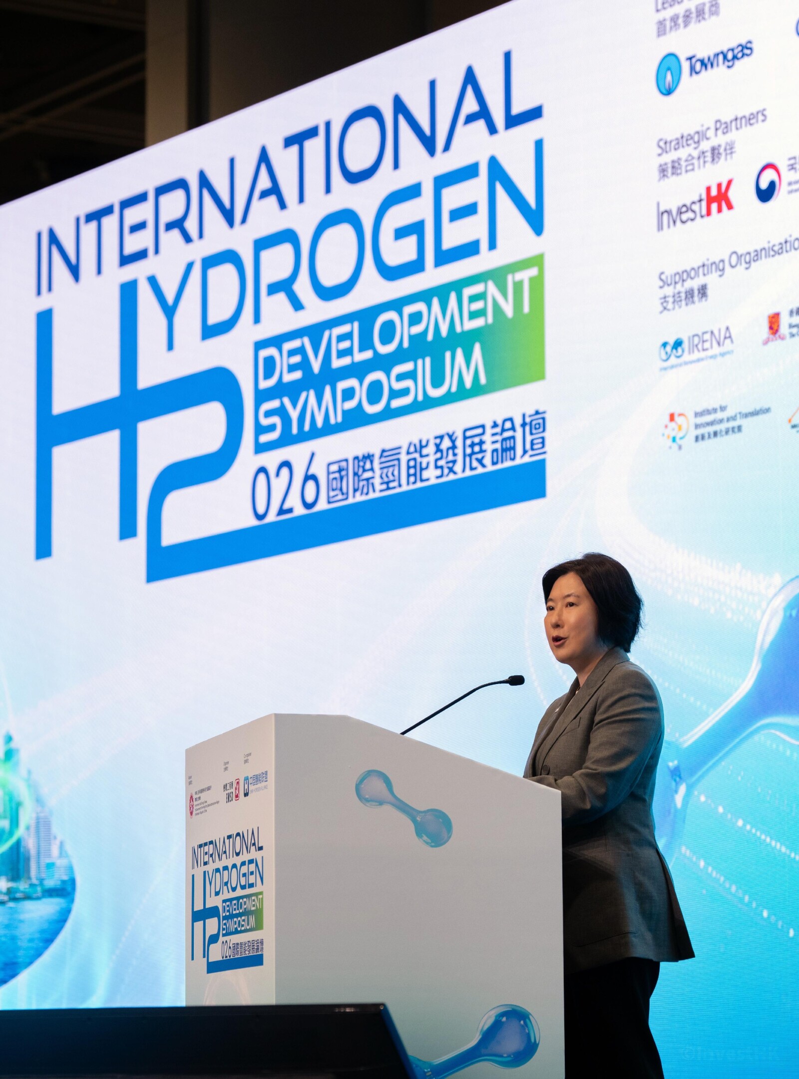 At the International Hydrogen Development Symposium 2026 today (May 18), nine pioneering companies from Korea, the Chinese Mainland, France, and Hong Kong - including Hyundai Motor Group - signed a landmark Memorandum of Understanding on hydrogen ecosystem building, marking a major step toward advancing the city's green economy. Photo shows the Director-General of Investment Promotion of Invest Hong Kong, Ms Alpha Lau, delivering a speech.